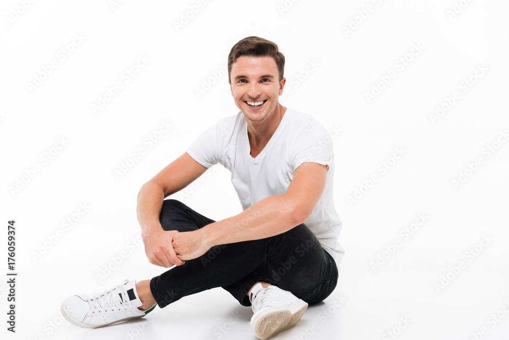 Portrait of a cheerful young man in white t-shirt Portrait of a cheerful young man in white t-shirt