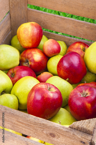 Fresh apples in wooden box