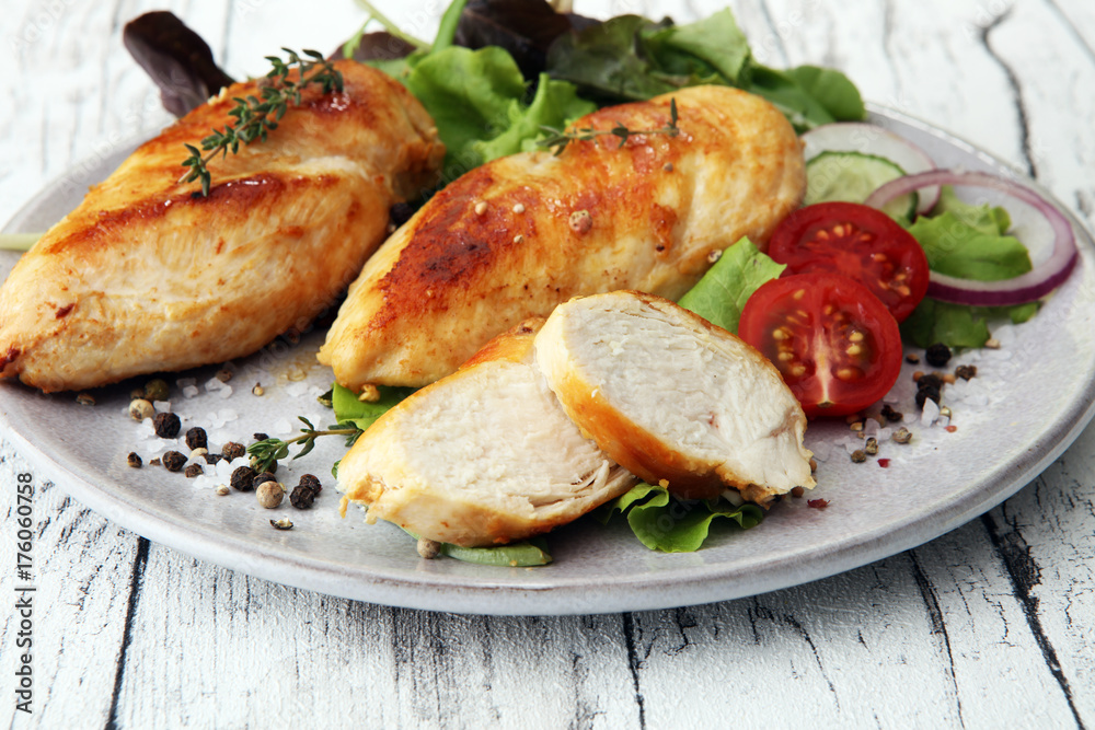 Grilled Chicken Breast with Salad and cherry tomatoes.