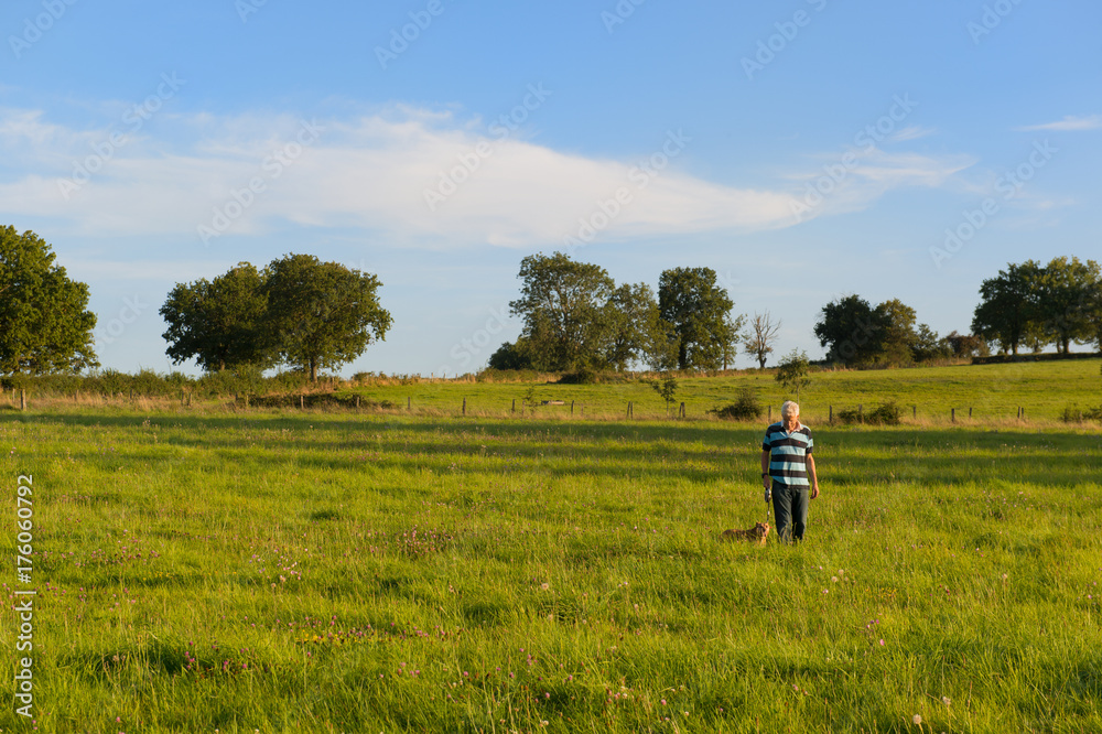 Man with dog in landscape Man with dog in landscape