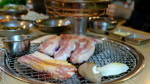 Korean barbecue stoves with chacoal inside ready for yakiniku. (Jeju pork belly)