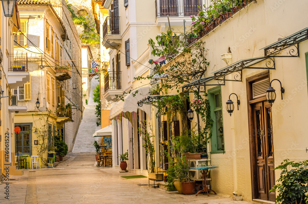 Nafplio-one of the narrow cobblestone alleys with the neoclassical well preserved buildings of the old town.