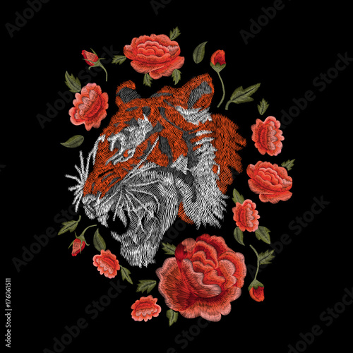tiger and roses, orange. traditional stylish fashionable floral embroidery on the black background. sketch for printing on clothing, fabric, bag, accessories and design