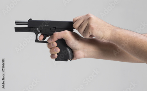 Man hand with gun
