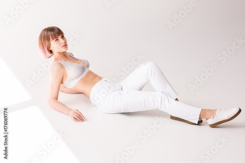 Young woman posing on floor