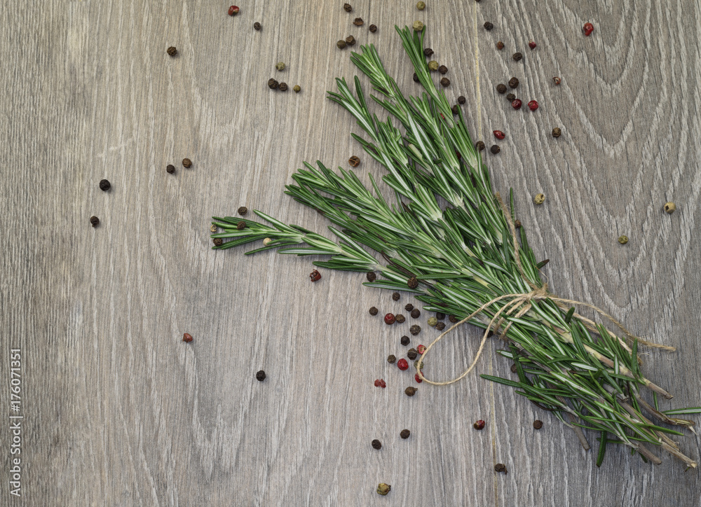 Rosmarin on gray wood.