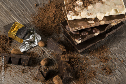 Chocolate / Chocolate bar on dark wooden background