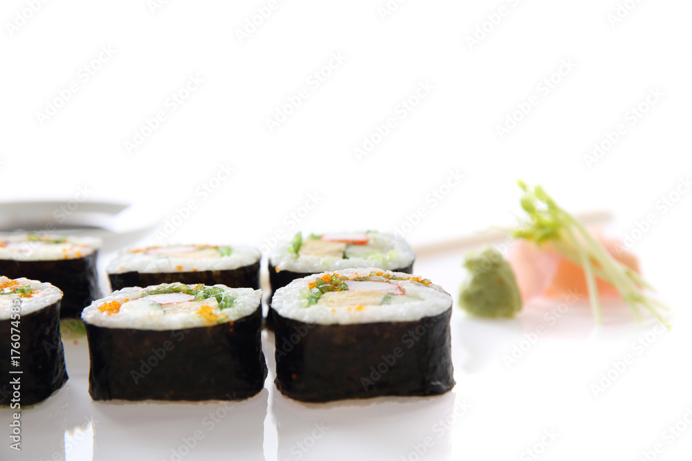 Futomaki sushi , Japanese roll rice egg avocado cucumber and caviar isolated in white background Futomaki sushi , Japanese roll rice egg avocado cucumber and caviar isolated in white background