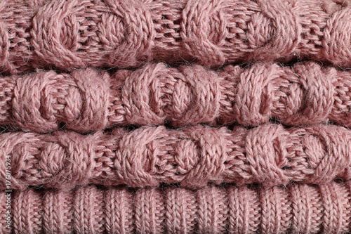 A pile of women s winter pink sweaters