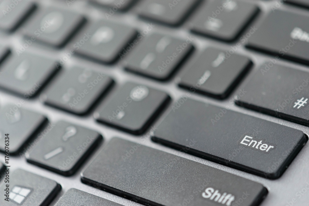 Close up view of enter key on a computer keyboard keys Close up view of enter key on a computer keyboard keys
