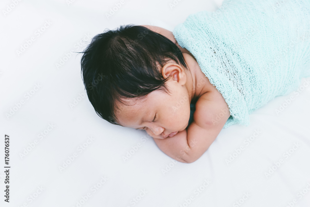 Newborn Baby Sleeping Peacefully Over White Bed Newborn Baby Sleeping Peacefully Over White Bed