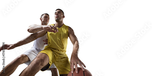 Two basketball players fight for the basketball ball. Isolated basketball players on a white background. Player wears unbranded clothes. Bottom view.