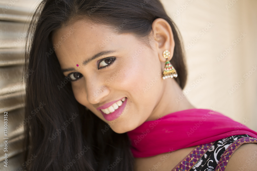 Portrait of young Indian woman smiling in daylight Portrait of young Indian woman smiling in daylight