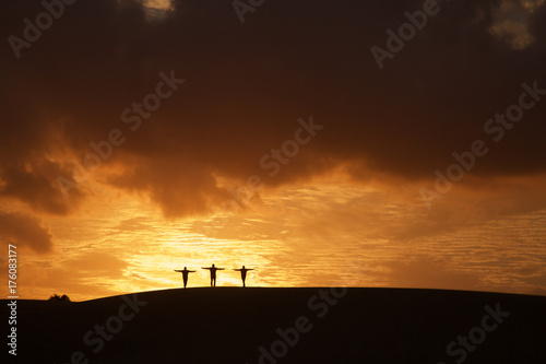 Sunset three crosses on hill