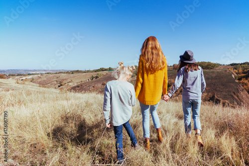 Happy family - mom and two daughters