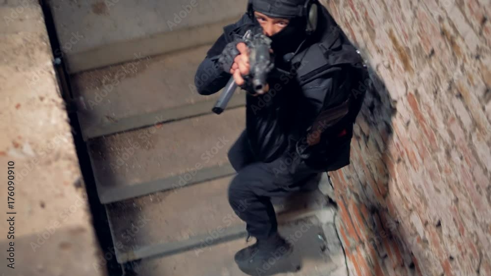 Two armed snipers walking up the stairs during hostage release operation. 4K. Two armed snipers walking up the stairs during hostage release operation. 4K.