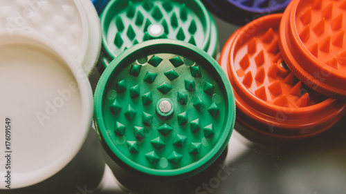 Slika na platnu color grinders for weed buds buds close-up. .