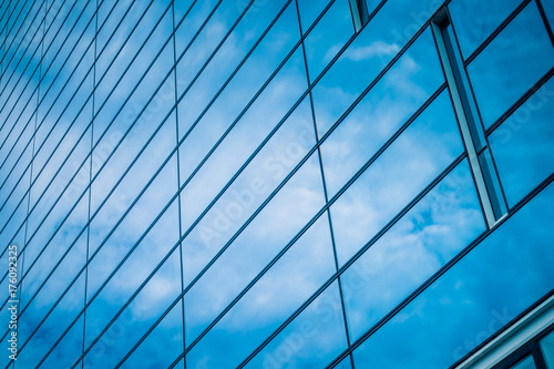 Clouds Reflected in Windows of Modern Office Building..