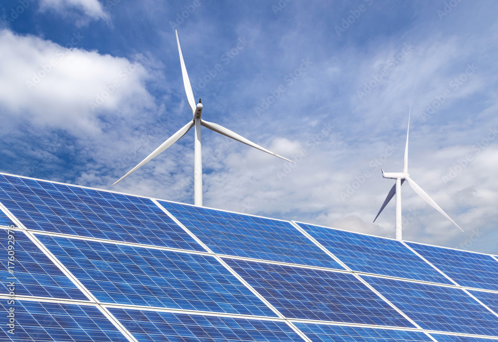 solar panels and wind turbines generating electricity in power station ...
