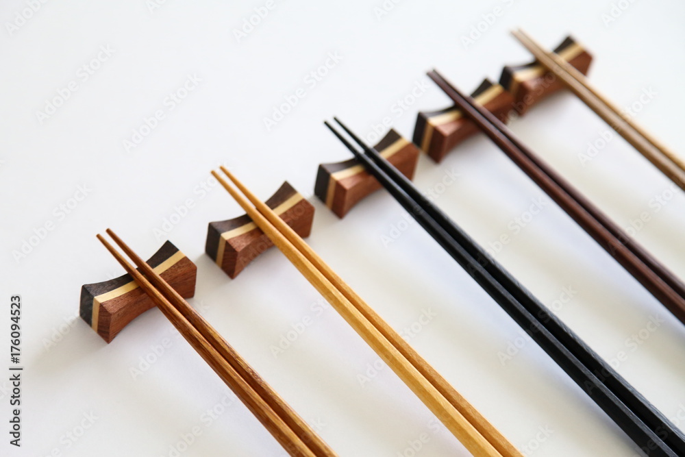 Beautiful collection of wooden chopsticks isolated on white background Beautiful collection of wooden chopsticks isolated on white background