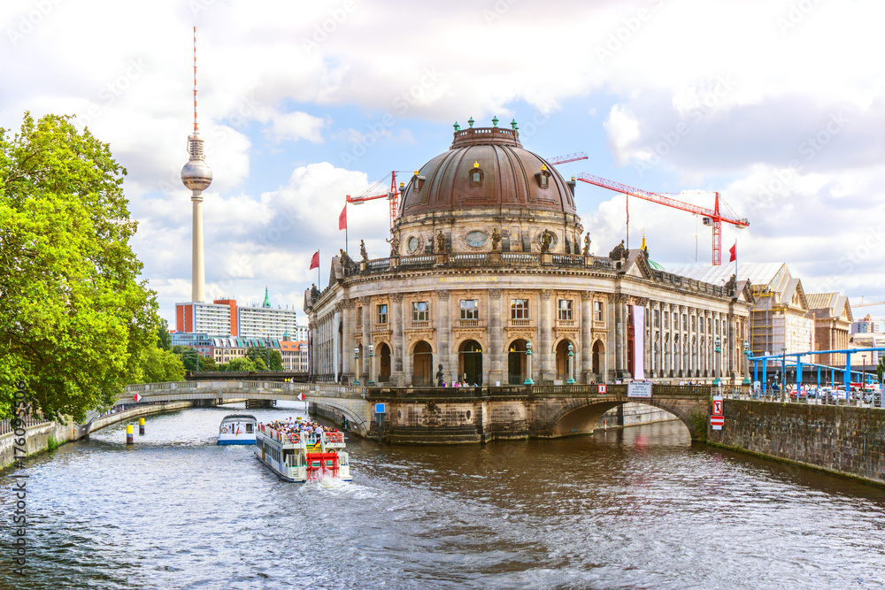 Berlin with Bode museum and boats with tourists on a sightseeing tour on the River Spree