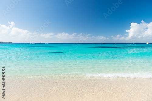 Beautiful white clouds on blue sky over calm sea