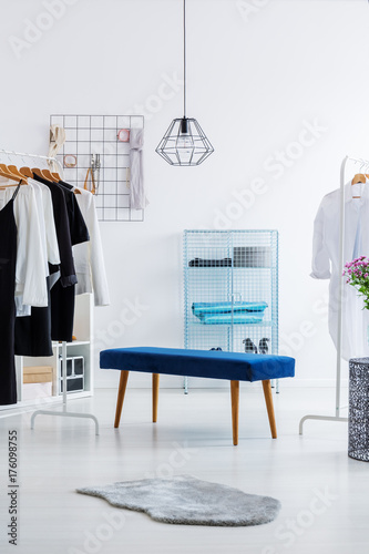 Bright wardrobe with blue stool © Photographee.eu