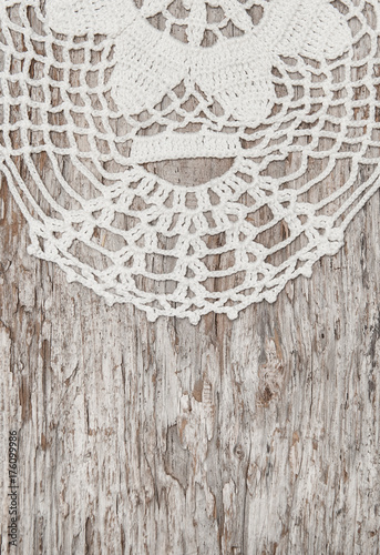 Vintage lace fabric border on the old wood