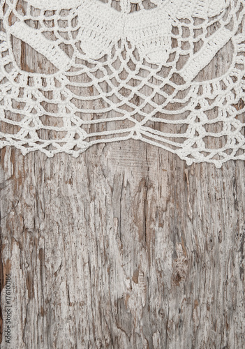 Vintage lace fabric border on the old wood