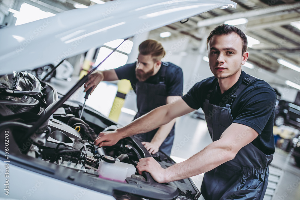Handsome auto service mechanics Handsome auto service mechanics