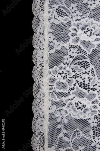 white floral lace on a black background