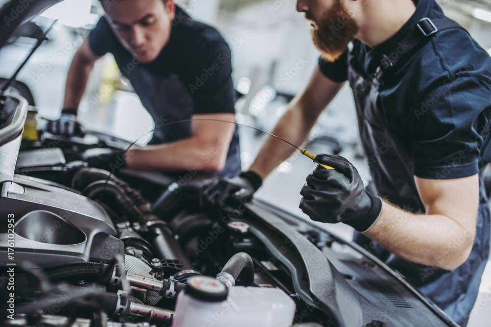 Handsome auto service mechanics