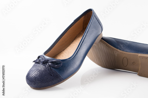 Female blue leather shoe on white background, isolated product.