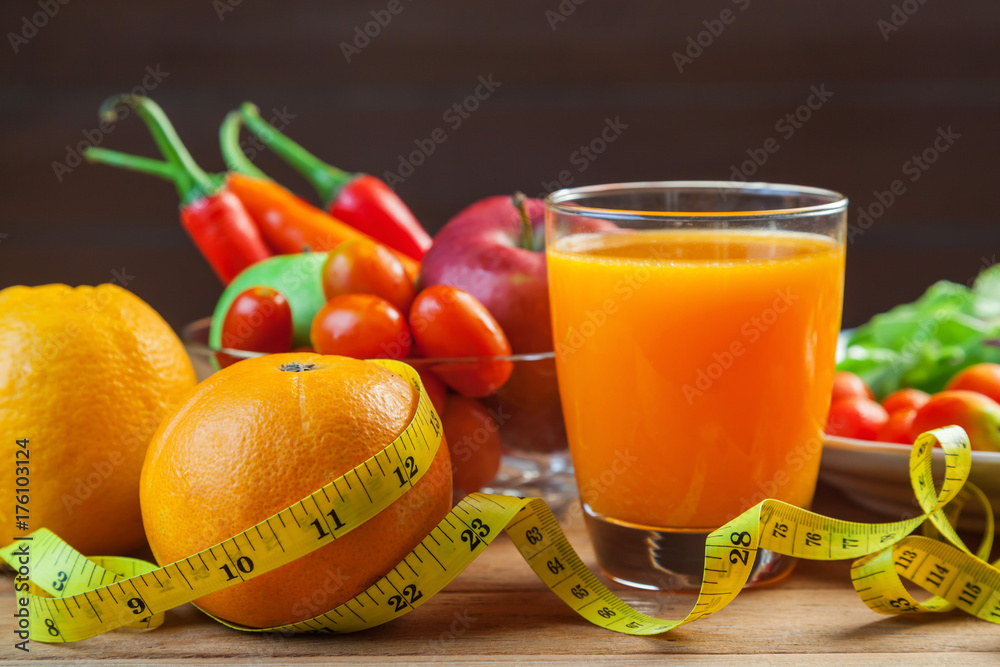 Healthy concept with mixed fruits and vegetables on wooden background Healthy concept with mixed fruits and vegetables on wooden background
