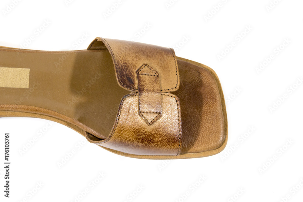 Female brown leather slipper on white background, isolated product. Female brown leather slipper on white background, isolated product.