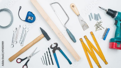 Top shot on DIY tools arranged on white background. 4k stop motion animation.