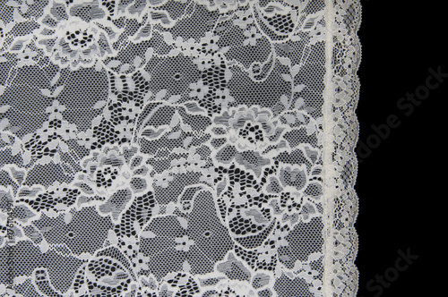 white floral lace on a black background