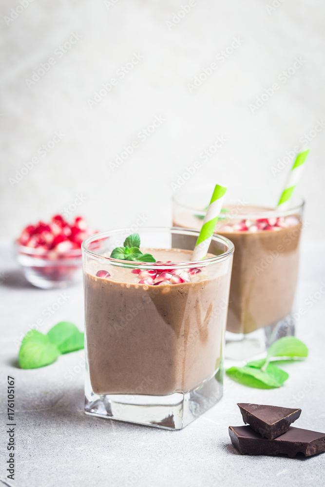 Almond milk veagan cocoa pomegranate smoothie. Selective focus, space for text. Almond milk veagan cocoa pomegranate smoothie. Selective focus, space for text.