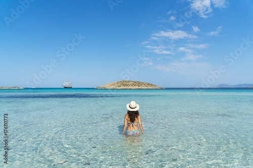Young woman in a paradise beach photo