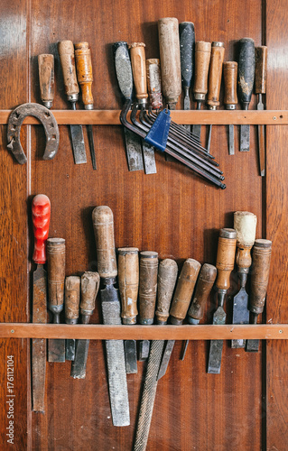Old Carpenter Tools on a Wooden Wall