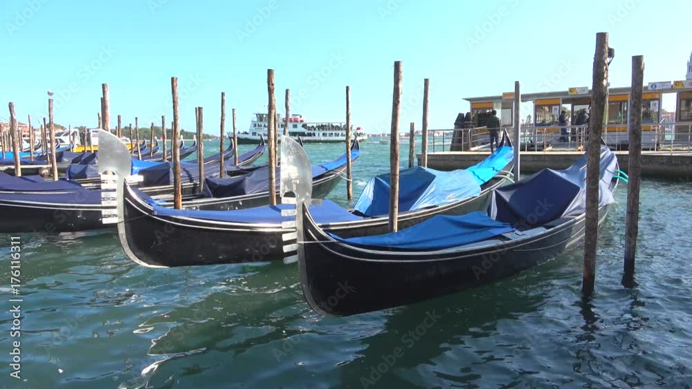 Moored gondolas closeup on a sunny day. Venice Moored gondolas closeup on a sunny day. Venice
