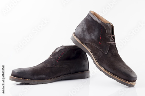 Male brown leather boot on white background, isolated product, comfortable footwear.