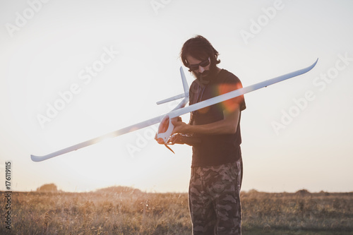 Man preparing to launch RC glider