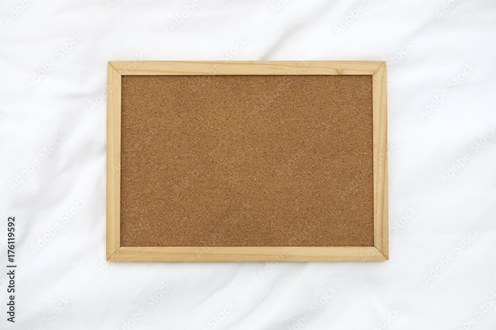 Fototapeta premium Wooden frame for photo on the fabric background