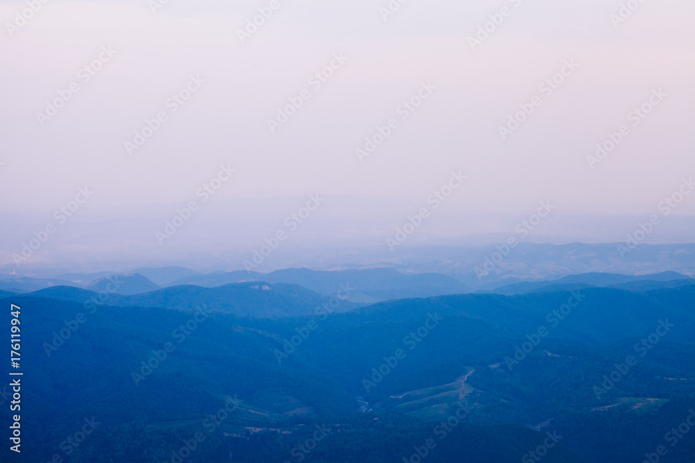 Layers of blue mountains on morning light