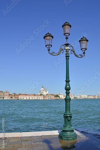 A view of the island of Dorsodoro in Venice taken from the island of Giudecca across the Giudecca Canal. Santa Maria Della Salute can be seen towering above the other buildings   © dragoncello