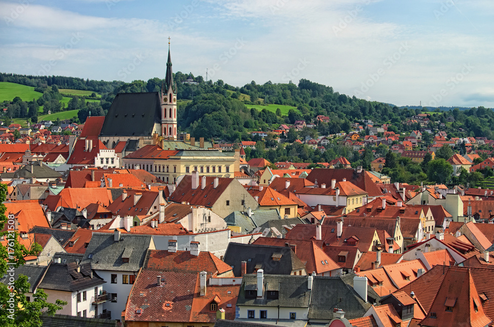 Red tile roofs cityscape. Church of Saint Vitus- UNESCO World Heritage Site. Summer sunny day. Cesky Krumlov (Krumau), Czech Republic