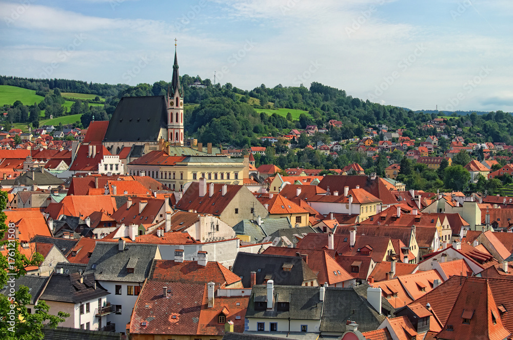 Obraz premium Red tile roofs cityscape. Church of Saint Vitus- UNESCO World Heritage Site. Summer sunny day. Cesky Krumlov (Krumau), Czech Republic