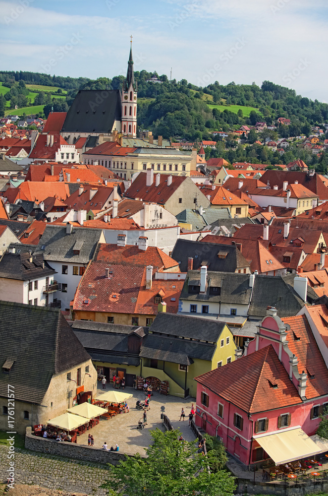 CESKY KRUMLOV, THE CZECH REPUBLIC: AUGUST 24, 2017: A famous czech historical beautiful town, view to the city river and beautiful summer street with colorful buildings
