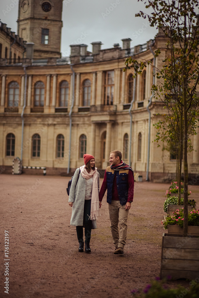 Beautiful pair of lovers walking in the autumn Park